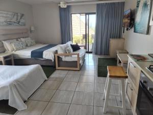 Ένα ή περισσότερα κρεβάτια σε δωμάτιο στο Banana beach club F1