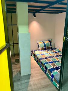 a bedroom with a bed in a room at Apiary Capsule 1 in Phnom Penh