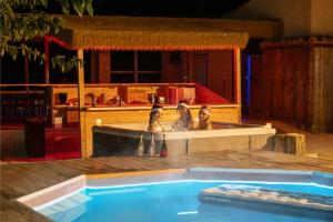 a swimming pool with two figurines in the middle at Za Teresa - Napoleonic Private Resort & Spa Heated Pool all included in Giuliano Teatino