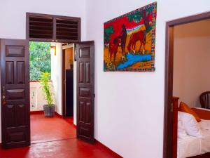 Ένα ή περισσότερα κρεβάτια σε δωμάτιο στο Mahagedara