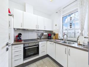 Kuchyň nebo kuchyňský kout v ubytování Nordseescholle