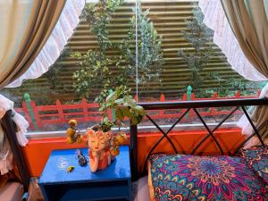 a table with a plant on top of a window at Cà's Garden in Khu Chi Lăng +15 photos