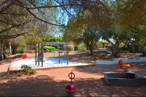 Κήπος έξω από το Duplex vue mer avec clim wifi dans résidence piscine mer à pied