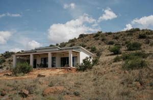 a house on the side of a hill at Bergendam Eco Lodge in Venterstad