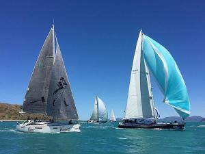a group of sailboats in the ocean on the water at Coral Mango in Airlie Beach