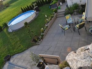 a backyard with a bath tub in the grass at Wohnung Mit Großer Gartenterrasse Und Ausblick in Argenbühl