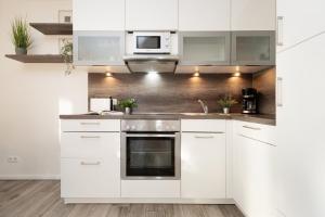 Kuchyň nebo kuchyňský kout v ubytování Bürgermeister-Fox 44a An der Waterkant