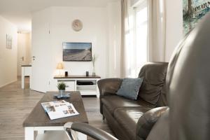 TV a/nebo společenská místnost v ubytování Bürgermeister-Fox 44a An der Waterkant
