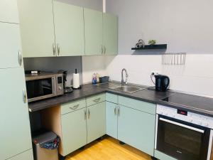 Kuchyň nebo kuchyňský kout v ubytování Gemütliche Zimmer - Messe Gruga + 28 fotografií