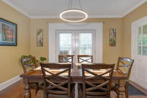 a dining room with a wooden table and chairs at Trailside Escape in Columbus