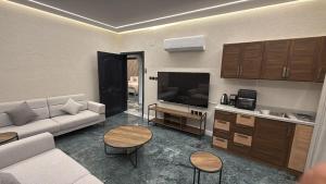 Μια τηλεόραση ή/και κέντρο ψυχαγωγίας στο اجنحة احسان الفاخرة