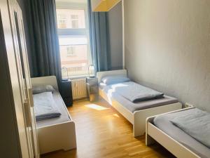 Postel nebo postele na pokoji v ubytování Gemütliche Zimmer - Messe Gruga