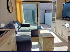 TV a/nebo společenská místnost v ubytování Duplexstudio Villa Nova