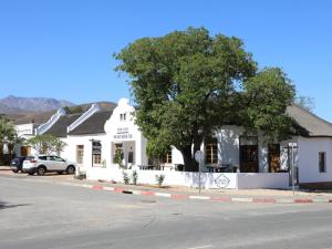 a white building on the side of a street at The Old Posthouse in Ladismith