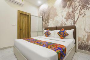 Ένα ή περισσότερα κρεβάτια σε δωμάτιο στο Via Godbless