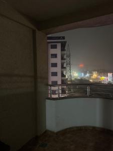 a room with a view of a city at night at 2A Apartment in Prizren