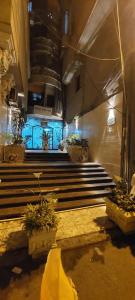 a room with stairs and blue lights in a building at BLUE Sky in Alexandria