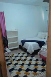 Postel nebo postele na pokoji v ubytování Quarto na praia banheiro compartilhado + 10 fotografií