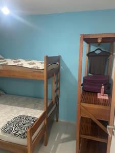 two bunk beds in a room with a zebraebra at Apartamento Itapoá in Itapoa
