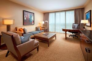 a large living room with a couch and a desk at The St. Regis Houston in Houston