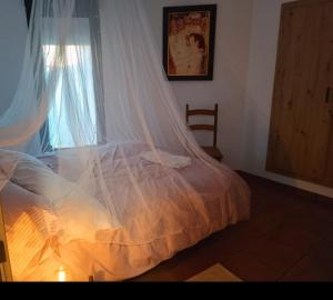 Ένα ή περισσότερα κρεβάτια σε δωμάτιο στο Molino de Tábara +10 φωτογραφίες