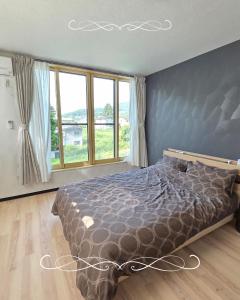 Ένα ή περισσότερα κρεβάτια σε δωμάτιο στο ドリームヴィラ