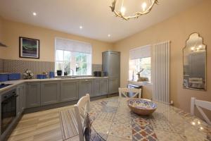 a kitchen with a table with a bowl on it at Church Cottage in Lochend
