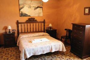 Ένα ή περισσότερα κρεβάτια σε δωμάτιο στο Casa Rural LES PLETES