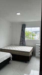 En eller flere senge i et værelse på Hospedagem Areias do Mariscal