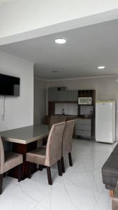 Køkken eller tekøkken på Hospedagem Areias do Mariscal