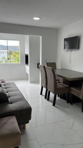 Et tv og/eller underholdning på Hospedagem Areias do Mariscal