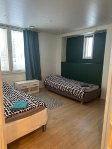 Postel nebo postele na pokoji v ubytování Hostel400Kokkola Kolmio Mannerheiminaukio