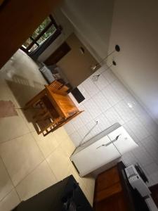 an overhead view of a kitchen with white tile at Bela vista in Paraty +4 photos