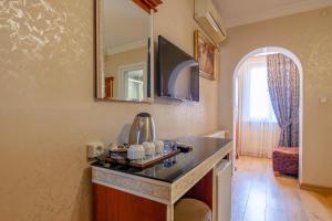 a kitchen with a counter and a mirror on the wall at Big Apple Hotel and Hostel in Istanbul