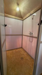 a bathroom with a shower and a walk in shower at Luxury berber style in Merzouga +46 photos