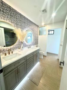 a bathroom with a sink and a mirror at Private Scottsdale Oasis in Scottsdale