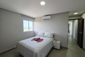 Ένα ή περισσότερα κρεβάτια σε δωμάτιο στο Divino 2 Quartos com Piscina e Vista Incrível +35 φωτογραφίες