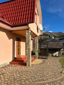 Budova, kde se apartmán nachází + 1 fotografie