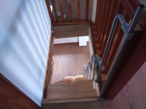 an overhead view of a wooden staircase with a stair railing at Jurahaus Solnhofen in Solnhofen +7 photos
