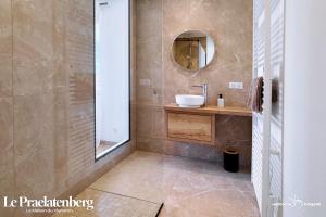 a bathroom with a sink and a mirror at Combo Praelatenberg 2 appartements dans la même maison in Orschwiller +29 photos