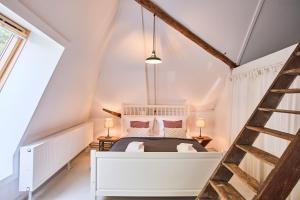 Postel nebo postele na pokoji v ubytování Altes Fährhaus & Bäckerhaus (komplett)