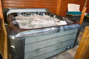 a large bath tub with snow in it at Chez Nathalie et Jean Hugues in Le Onzième
