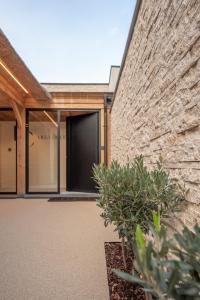 a building with a brick wall and a door at Luxe Guestroom free bikes and parking in Bruges