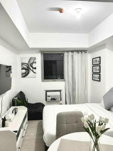 Ένα ή περισσότερα κρεβάτια σε δωμάτιο στο Unwind Elevé