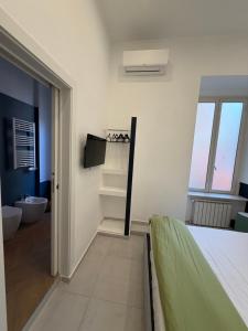 TV a/nebo společenská místnost v ubytování Dimora Merliani