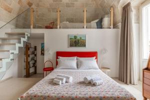 a bedroom with a bed with towels on it at MandorleOlio in Polignano a Mare +291 photos