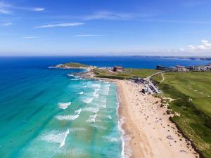 an aerial view of a beach and the ocean at 1 Bed Apartment in Town Centre in Newquay