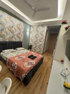 Voodi või voodid majutusasutuse Gold stay toas