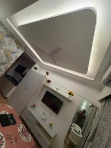 Televiisor ja/või meelelahutuskeskus majutusasutuses Gold stay