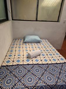 Postel nebo postele na pokoji v ubytování Casita Chipilapa en Antigua Guatemala